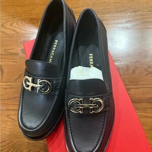 Salvatore Ferragamo Black Loafers with Gold Accents